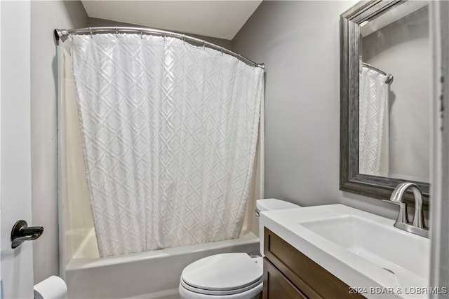 full bathroom featuring lofted ceiling, shower / bath combo, vanity, and toilet