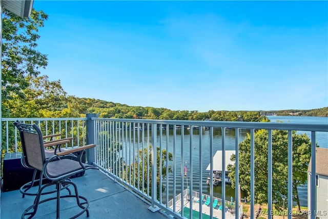 balcony featuring a water view