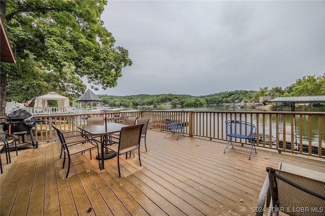 deck featuring a water view