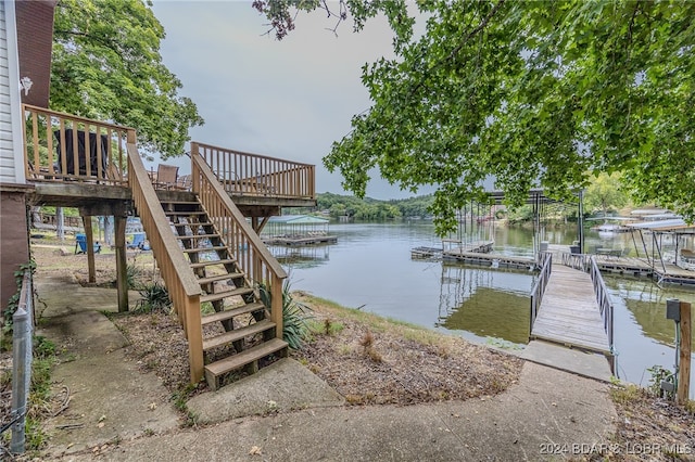 dock area featuring a deck with water view