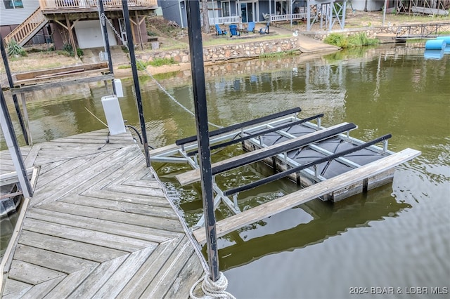 dock area featuring a water view