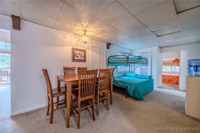 dining room featuring plenty of natural light and carpet floors