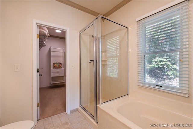 bathroom featuring ornamental molding, separate shower and tub, tile patterned floors, and toilet