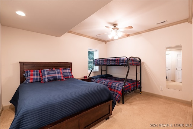 bedroom featuring carpet floors, crown molding, and ceiling fan