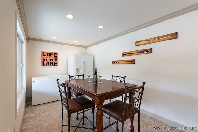 dining room featuring ornamental molding