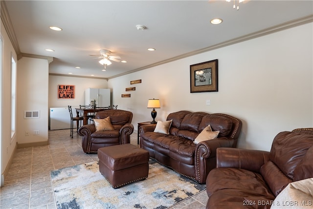 living room featuring ornamental molding and ceiling fan