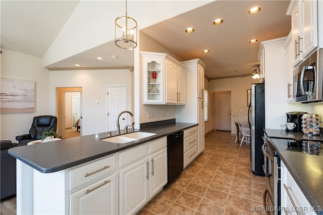 kitchen with sink, stainless steel appliances, hanging light fixtures, lofted ceiling, and white cabinetry