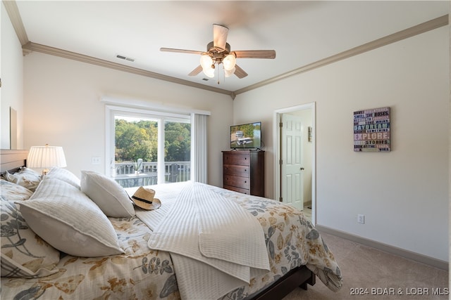 bedroom with ceiling fan, ornamental molding, and carpet