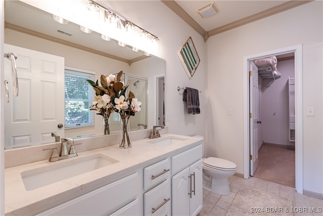 bathroom featuring crown molding, toilet, tile patterned flooring, and vanity