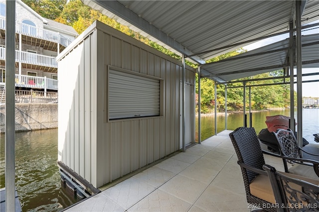 view of outbuilding with a water view