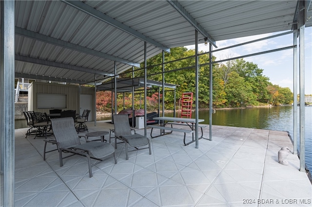 view of patio featuring a water view