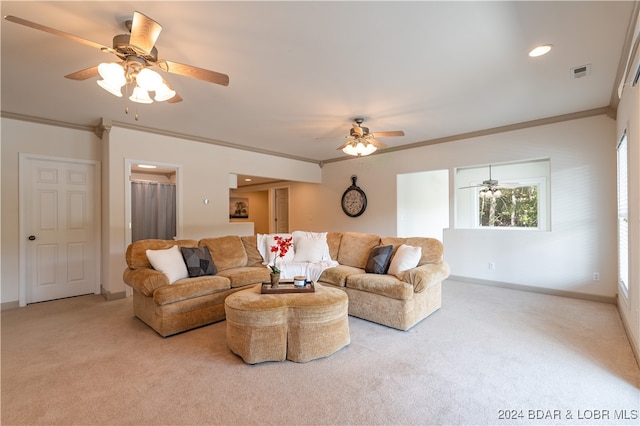 carpeted living room featuring crown molding and ceiling fan