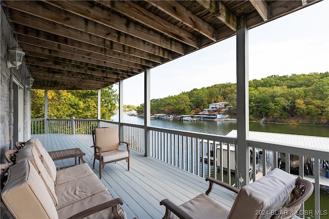 wooden terrace featuring a water view