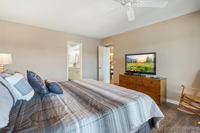 bedroom with ensuite bathroom, dark hardwood / wood-style flooring, and ceiling fan