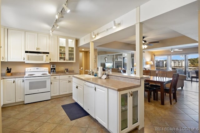 kitchen featuring ceiling fan, white cabinets, white appliances, sink, and light tile patterned floors