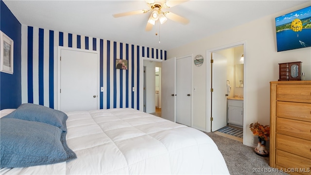 carpeted bedroom with ceiling fan and connected bathroom