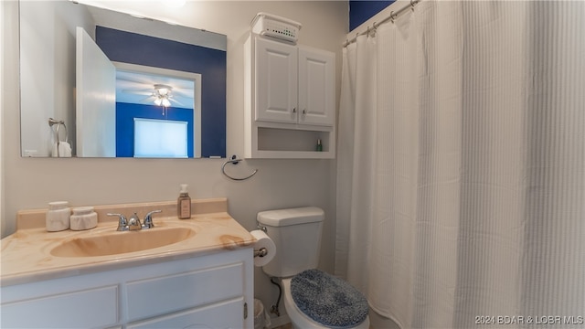 bathroom with ceiling fan, vanity, and toilet