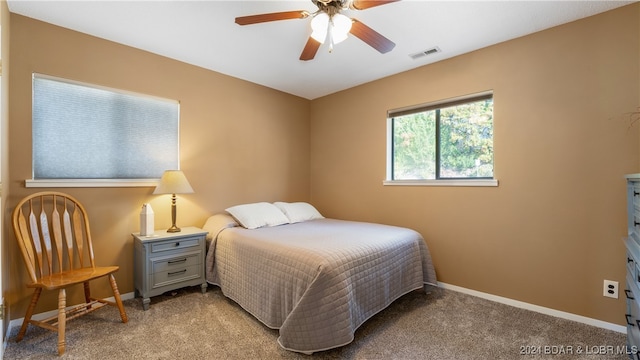 carpeted bedroom with ceiling fan