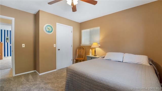 bedroom with light carpet and ceiling fan