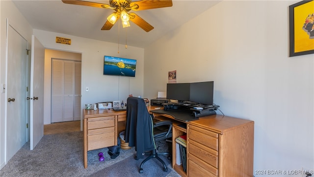 office area with dark colored carpet and ceiling fan