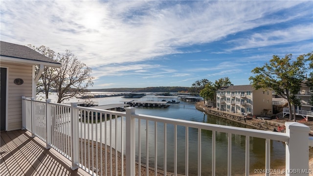 balcony featuring a water view