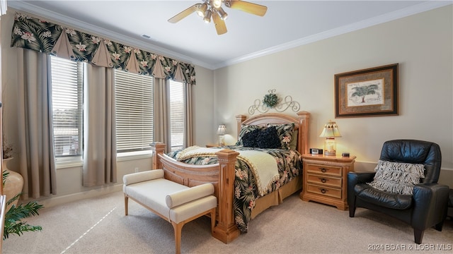 carpeted bedroom featuring ceiling fan, ornamental molding, and multiple windows