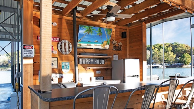 interior space featuring ceiling fan