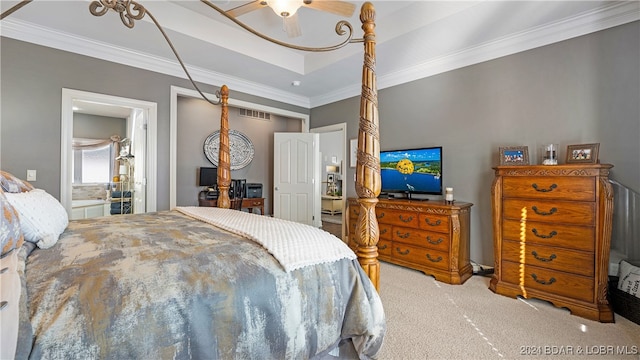 bedroom featuring crown molding, light colored carpet, and ceiling fan