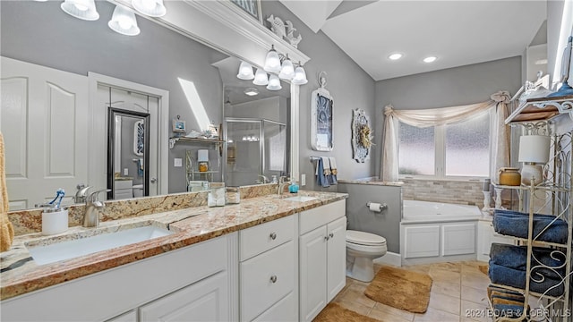 full bathroom featuring vanity, shower with separate bathtub, toilet, and tile patterned flooring