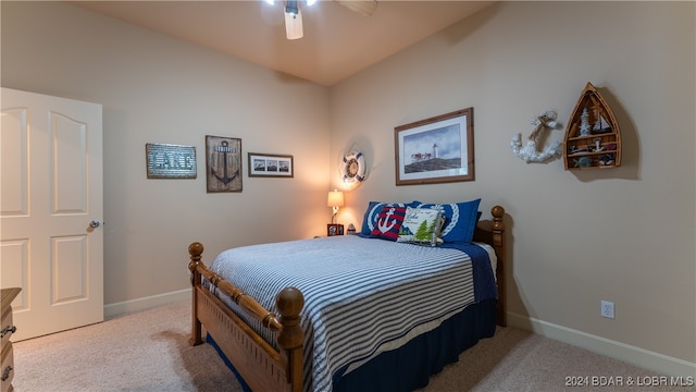 bedroom with light colored carpet and ceiling fan