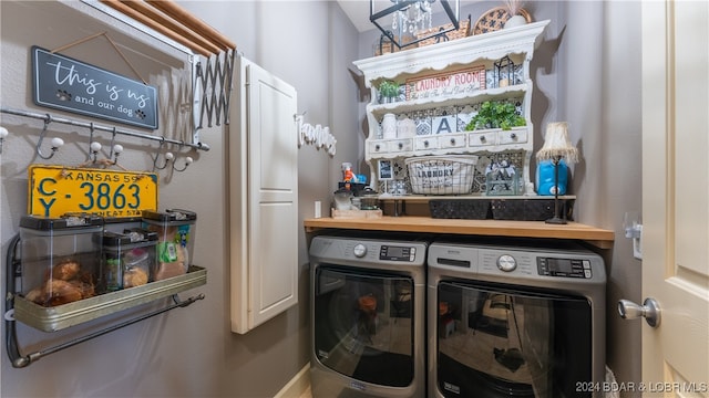 clothes washing area featuring separate washer and dryer