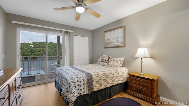 bedroom with access to outside, light wood-style flooring, baseboards, and ceiling fan