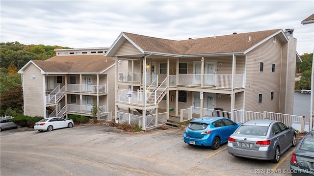 view of property featuring uncovered parking