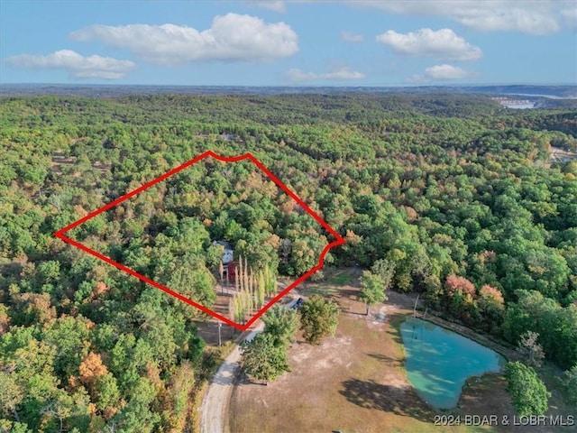 145 Higgins Rd, Camdenton, MO 65020 - aerial view of property's location featuring a heavily wooded area and property boundaries highlighted