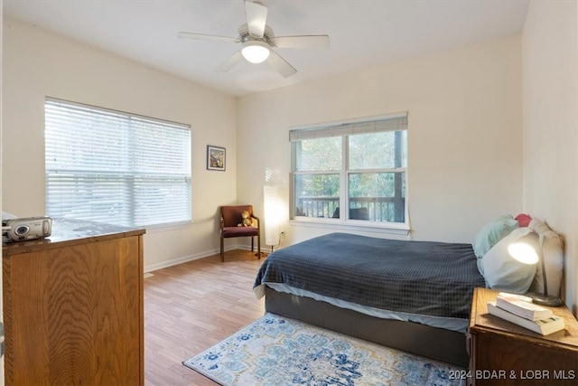 bedroom featuring light wood-type flooring and ceiling fan