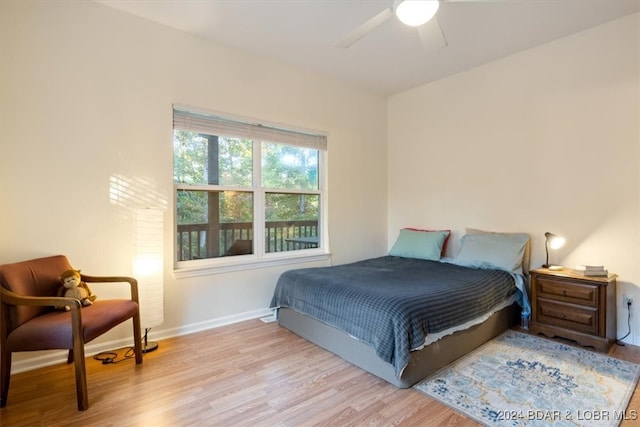 bedroom with light hardwood / wood-style floors and ceiling fan