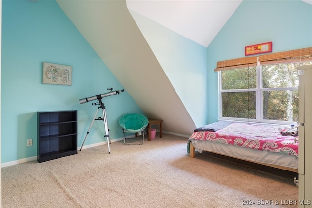 carpeted bedroom featuring vaulted ceiling