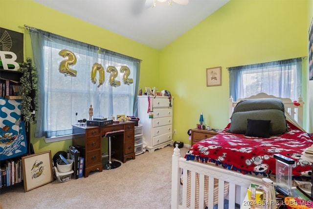 carpeted bedroom with lofted ceiling and ceiling fan