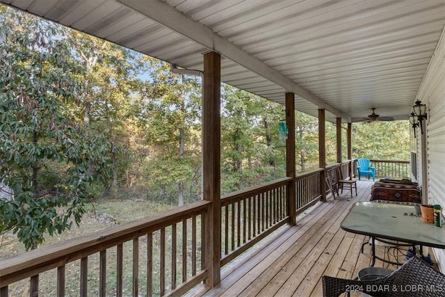 wooden terrace featuring ceiling fan