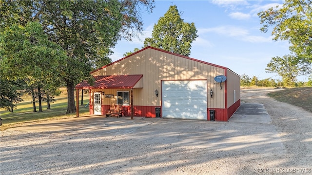 garage featuring wooden walls