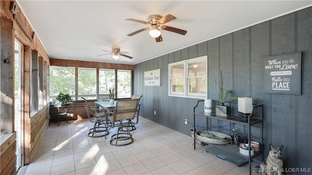 sunroom / solarium with plenty of natural light and ceiling fan