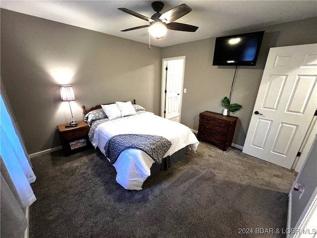 bedroom featuring dark colored carpet and ceiling fan