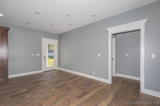 empty room featuring dark hardwood / wood-style floors