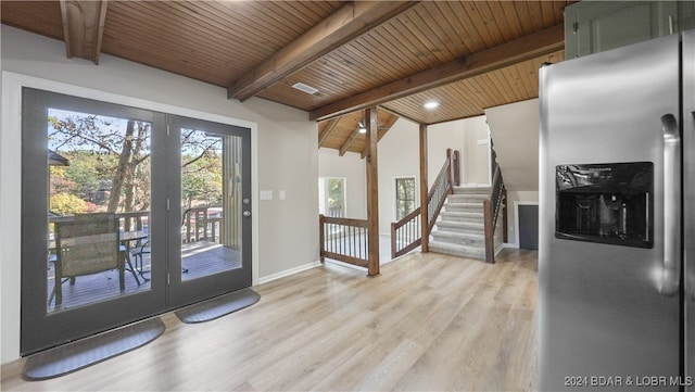 doorway to outside featuring light wood-type flooring, vaulted ceiling with beams, and wood ceiling