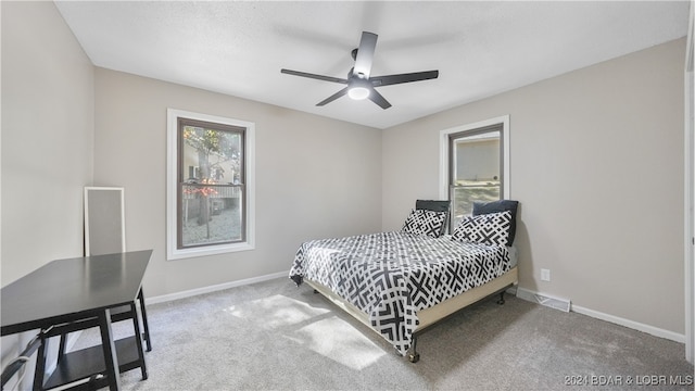 carpeted bedroom featuring ceiling fan