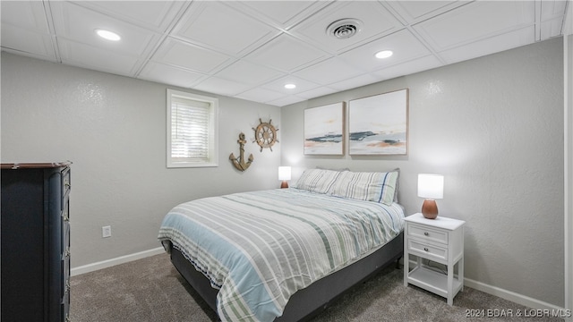 bedroom featuring dark colored carpet