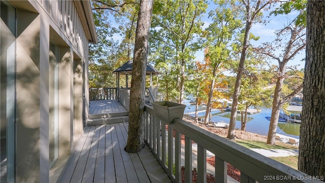 wooden deck with a water view