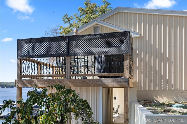 wooden deck featuring a water view