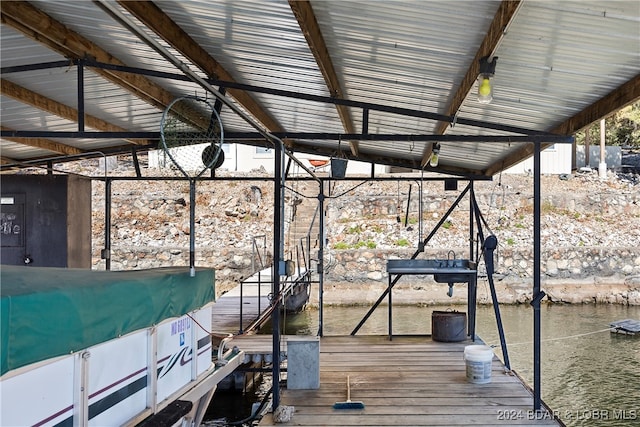 dock area with a water view