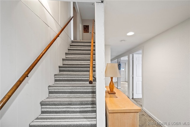 stairway with carpet floors